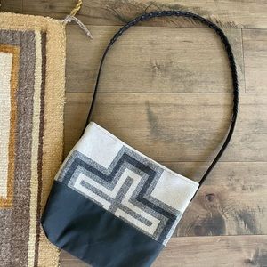 Pendleton fabric crossbody purse w/ wax cloth bottom. Interior pocket.